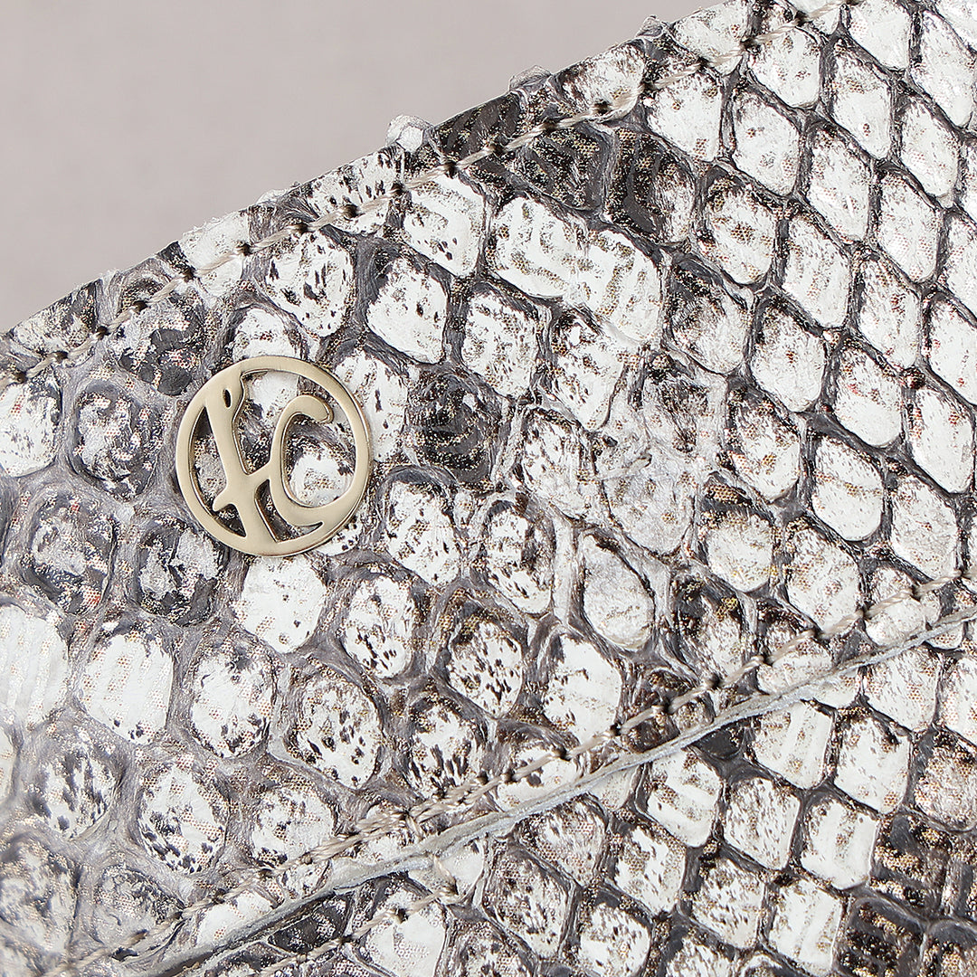 Sandalia en piel genuina de pitón para dama