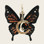 Charm de mariposa en piel genuina de pitón para dama
