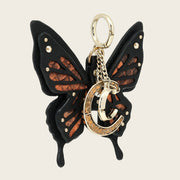 Charm de mariposa en piel genuina de pitón para dama