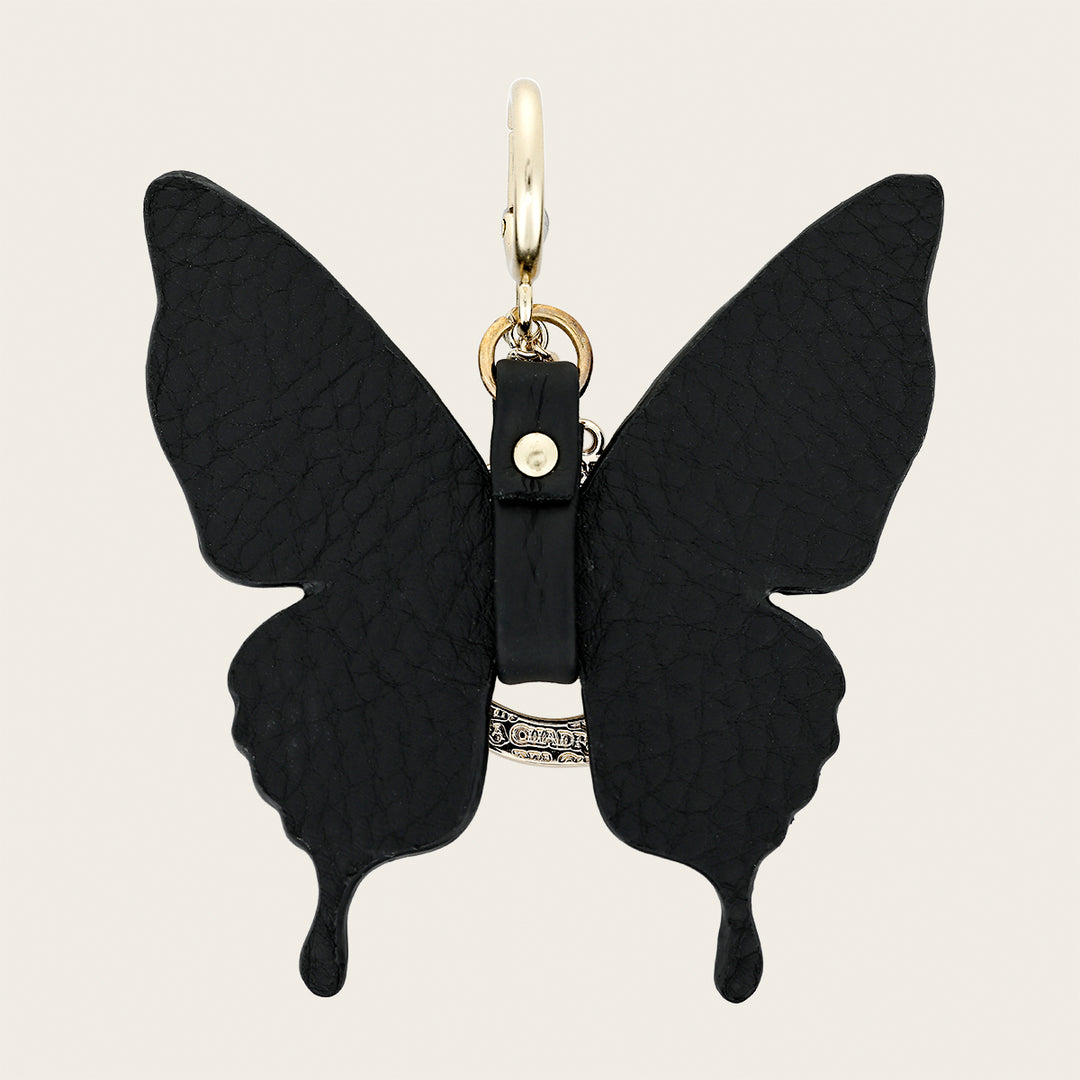 Charm de mariposa en piel genuina de pitón para dama