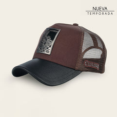 Gorra en piel genuina con diseño de pitón